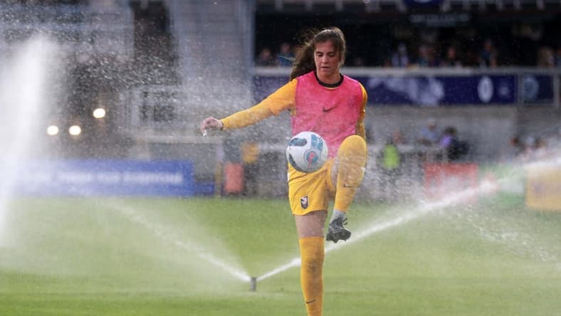 Jun 11, 2022; Louisville, Kentucky, USA; Angel City FC goalkeeper Maia Perez (24) warms up during half time as the sprinkler system runs against Racing Louisville FC at Lynn Family Stadium. Mandatory Credit: EM Dash-USA TODAY Sports