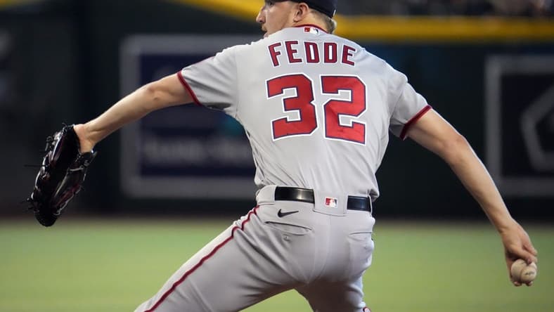 Jul 24, 2022; Phoenix, Arizona, USA; Washington Nationals starting pitcher Erick Fedde (32) pitches against the Arizona Diamondbacks during the first inning at Chase Field. Mandatory Credit: Joe Camporeale-USA TODAY Sports