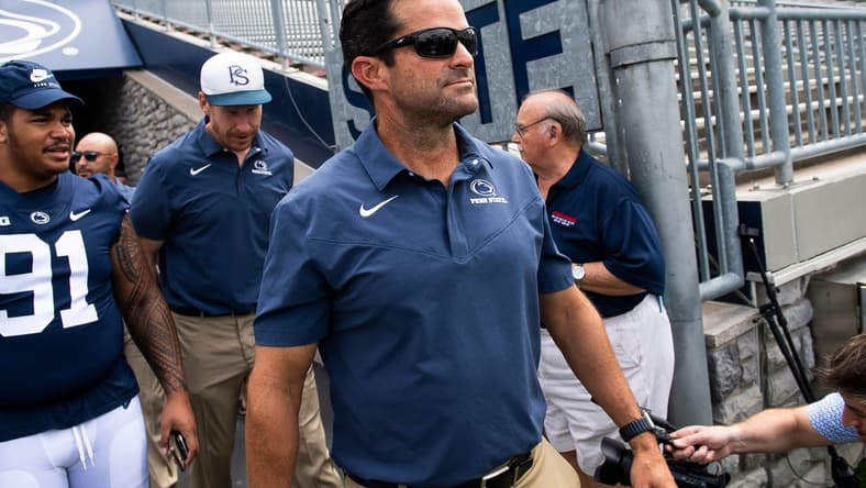 Penn State football defensive coordinator Manny Diaz walks onto the turf with other members of the team during football media day at Beaver Stadium on Saturday, August 6, 2022, in State College.
Hes Dr 080622 Psumedia
