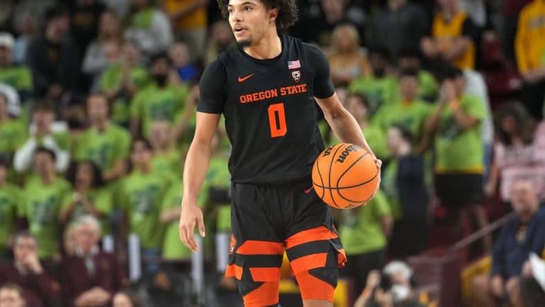 Feb 2, 2023; Tempe, Arizona, USA; Oregon State Beavers guard Jordan Pope (0) dribbles against the Arizona State Sun Devils during the first half at Desert Financial Arena. Mandatory Credit: Joe Camporeale-USA TODAY Sports