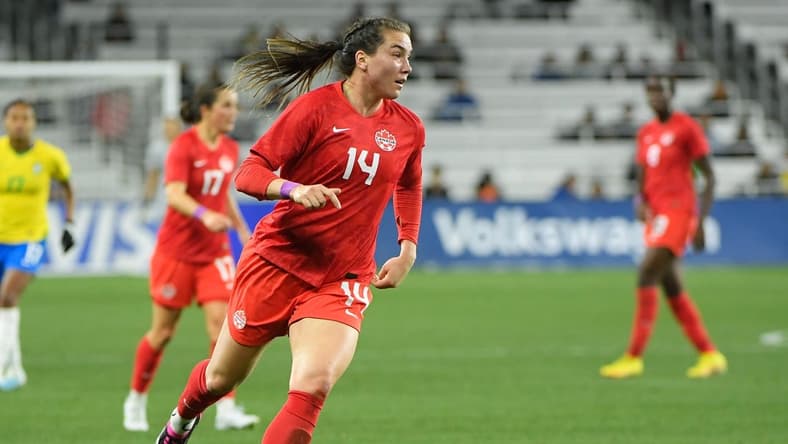 Feb 19, 2023; Nashville, Tennessee, USA; Canada defender Vanessa Gilles (14) dribbles the ball against Canada during the first half at Geodis Park. Mandatory Credit: Steve Roberts-USA TODAY Sports