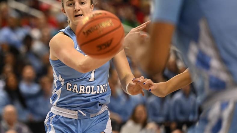Mar 3, 2023; Greensboro, NC, USA; North Carolina Tar Heels guard Alyssa Ustby (1) passes to a teammate during the first half at Greensboro Coliseum. Mandatory Credit: William Howard-USA TODAY Sports