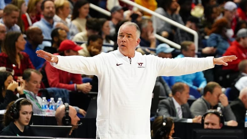 Mar 8, 2023; Greensboro, NC, USA; Virginia Tech Hokies head coach Mike Young signal to his players against the North Carolina State Wolfpack during the first half of the second round of the ACC tournament at Greensboro Coliseum. Mandatory Credit: John David Mercer-USA TODAY Sports