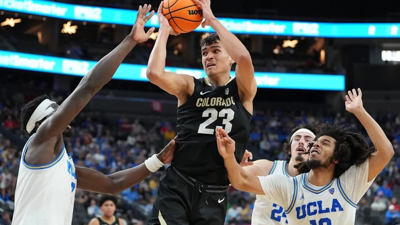 Mar 9, 2023; Las Vegas, NV, USA; Colorado Buffaloes forward Tristan da Silva (23) looks to shoot between UCLA Bruins forward Adem Bona (3) and guard Tyger Campbell (10) during the second half at T-Mobile Arena. Mandatory Credit: Stephen R. Sylvanie-USA TODAY Sports