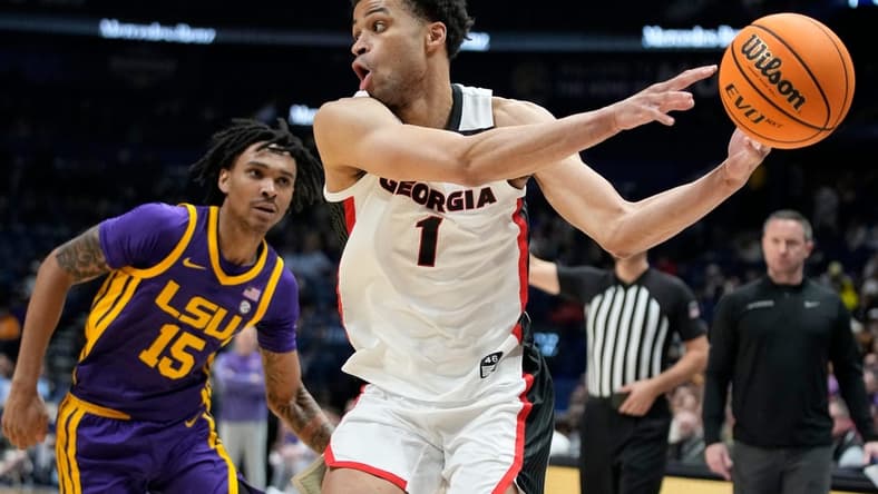 Georgia guard Jabri Abdur-Rahim (1) passes the ball past LSU forward Tyrell Ward (15) during the second half of a first round SEC Men s Basketball Tournament game at Bridgestone Arena Wednesday, March 8, 2023, in Nashville, Tenn.
Sec Basketball Lsu Vs Georgia