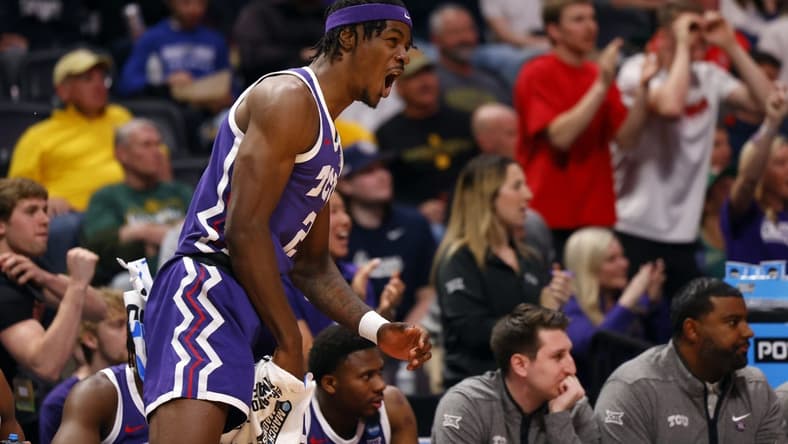 Mar 19, 2023; Denver, CO, USA; TCU Horned Frogs forward Emanuel Miller (2) celebrates on the bench in the first half against the Gonzaga Bulldogs at Ball Arena. Mandatory Credit: Michael Ciaglo-USA TODAY Sports