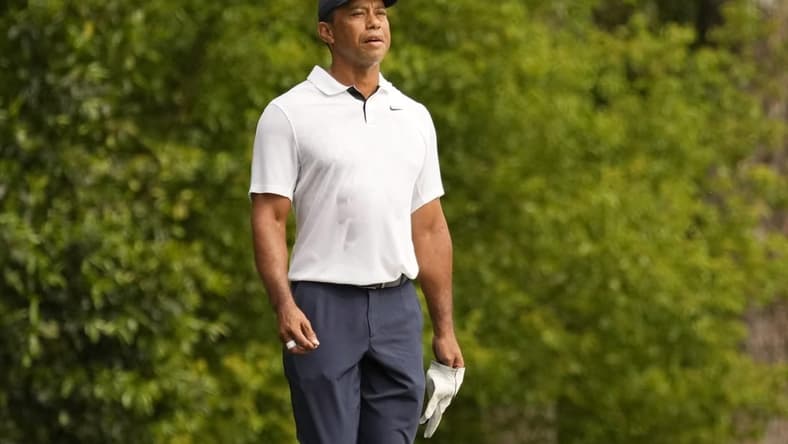 Apr 6, 2023; Augusta, Georgia, USA; Tiger Woods watches his shot on the second fairway during the first round of The Masters golf tournament. Mandatory Credit: Michael Madrid-USA TODAY Network