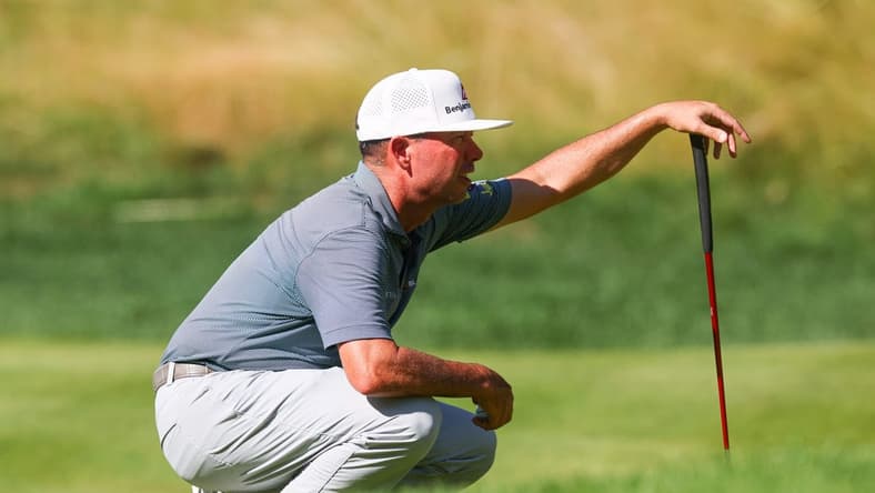 Jun 25, 2023; Cromwell, Connecticut, USA; Chez Reavie reads his putt on the 14th green during the final round of the Travelers Championship golf tournament. Mandatory Credit: Vincent Carchietta-USA TODAY Sports