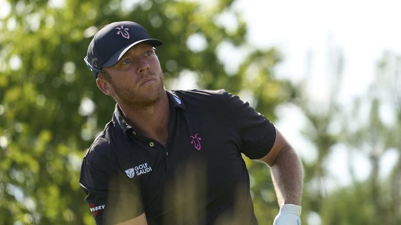 Jul 7, 2023; Hertfordshire, ENG; Talor Gooch (USA) plays his shot from the fourth tee during the first round of the LIV Golf London golf tournament at Centurion Club. Mandatory Credit: Peter van den Berg-USA TODAY Sports