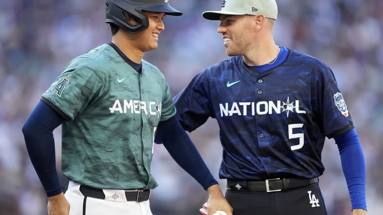 Jul 11, 2023; Seattle, Washington, USA; American League designated hitter/pitcher Shohei Ohtani of the Los Angeles Angels of Anaheim (17) reacts with National League first baseman Freddie Freeman of the Los Angeles Dodgers (5) during the fifth inning at T-Mobile Park. Mandatory Credit: Stephen Brashear-USA TODAY Sports