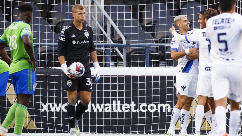 Jul 30, 2023; Seattle, WA, USA; Monterrey forward German Berterame (9, second from right) hugs defender Luis Romo (27) after scoring a goal against Seattle Sounders FC goalkeeper Stefan Cleveland (30) during the second half at Lumen Filed. Mandatory Credit: Joe Nicholson-USA TODAY Sports