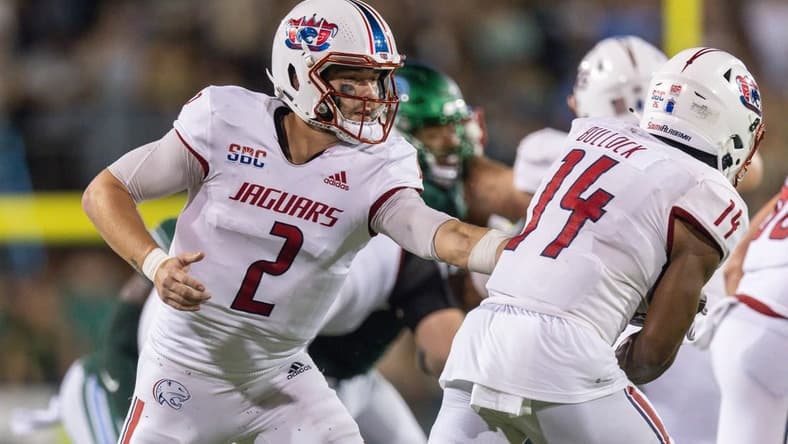 Sep 2, 2023; New Orleans, Louisiana, USA; South Alabama Jaguars quarterback Carter Bradley (2) hands the ball off to South Alabama Jaguars running back Kentrel Bullock (14) against the Tulane Green Wave during the first half at Yulman Stadium. Mandatory Credit: Stephen Lew-USA TODAY Sports