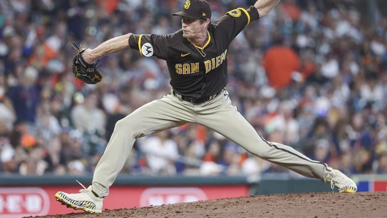 Sep 10, 2023; Houston, Texas, USA; San Diego Padres relief pitcher Tim Hill (25) delivers a pitch during the sixth inning against the Houston Astros at Minute Maid Park. Mandatory Credit: Troy Taormina-USA TODAY Sports