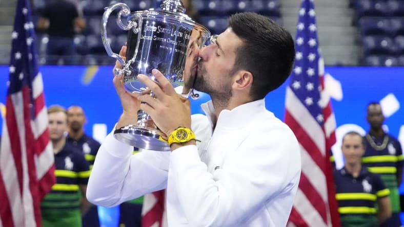 Sep 10, 2023; Flushing, NY, USA; Novak Djokovic of Serbia celebrates with the championship trophy after his match against Daniil Medvedev (not pictured) in the men's singles final on day fourteen of the 2023 U.S. Open tennis tournament at USTA Billie Jean King National Tennis Center. Mandatory Credit: Robert Deutsch-USA TODAY Sports