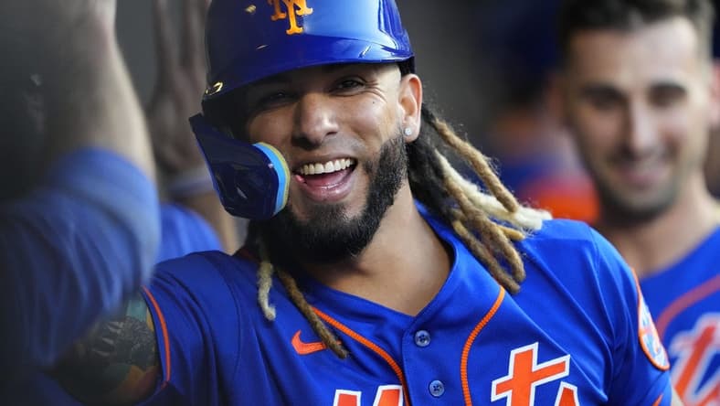 Sep 14, 2023; New York City, New York, USA; New York Mets third baseman Jonathan Arauz (19) is congratulated by teammate for hitting a three run home run against the Arizona Diamondbacks during the eighth inning at Citi Field. Mandatory Credit: Gregory Fisher-USA TODAY Sports
