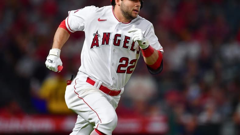 Sep 26, 2023; Anaheim, California, USA; Los Angeles Angels second baseman David Fletcher (22) runs after hitting a single against the Texas Rangers during the fifth inning at Angel Stadium. Mandatory Credit: Gary A. Vasquez-USA TODAY Sports