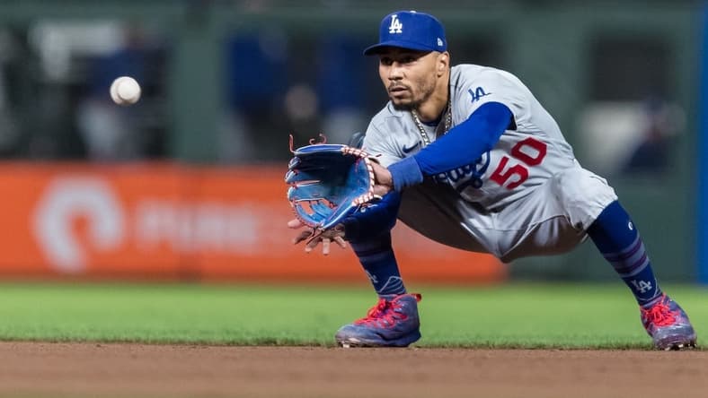Sep 29, 2023; San Francisco, California, USA; Los Angeles Dodgers second baseman Mookie Betts (50) catches a shallow fly ball for an out against the San Francisco Giants  during the eighth inning at Oracle Park. Mandatory Credit: John Hefti-USA TODAY Sports