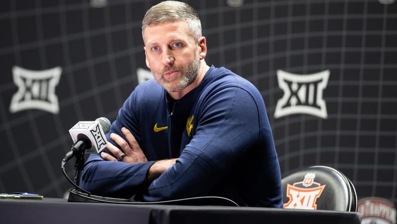Oct 18, Kansas City, MO, USA; West Virginia interim head coach Josh Eilert answers questions at Big 12 Men s Basketball Tipoff at T-Mobile Center. Mandatory Credit: Kylie Graham-USA TODAY Sports