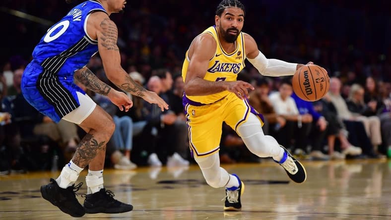 Oct 30, 2023; Los Angeles, California, USA; Los Angeles Lakers guard Gabe Vincent (7) moves to the basket against Orlando Magic guard Cole Anthony (50) during the second half at Crypto.com Arena. Mandatory Credit: Gary A. Vasquez-USA TODAY Sports