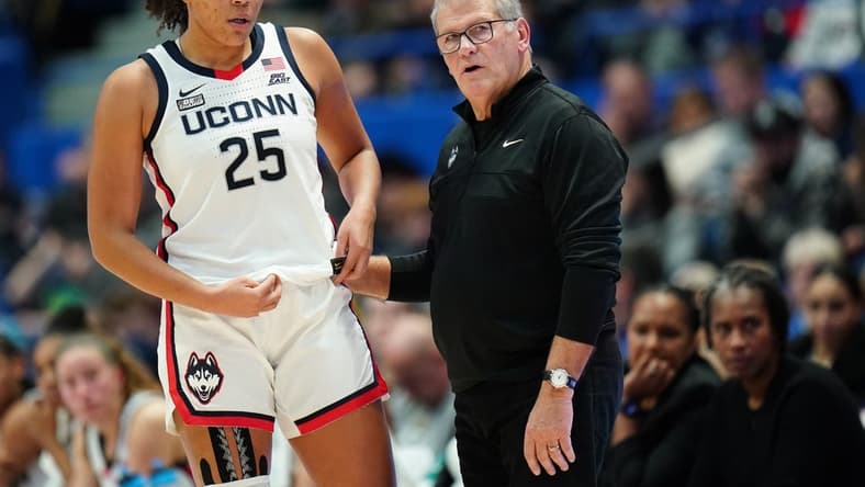 Nov 8, 2023; Hartford, Connecticut, USA; UConn Huskies head coach Geno Auriemma talks with forward Ice Brady (25) from the sideline as they take on the Dayton Flyers at XL Center. Mandatory Credit: David Butler II-USA TODAY Sports