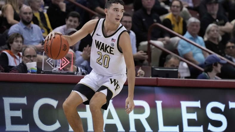 Nov 17, 2023; Charleston, SC, USA; Wake Forest Demon Deacons guard Parker Friedrichsen (20) brings the ball up court in the first half against the Towson Tigers at TD Arena. Mandatory Credit: David Yeazell-USA TODAY Sports