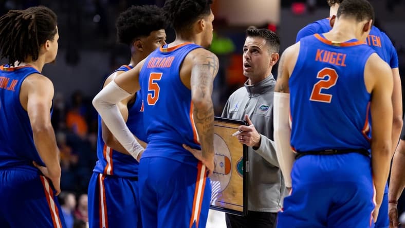 Nov 17, 2023; Gainesville, Florida, USA; Florida Gators head coach Todd Golden talks with Florida Gators guard Zyon Pullin (0), Florida Gators guard Walter Clayton Jr. (1), Florida Gators guard Will Richard (5), and Florida Gators guard Riley Kugel (2) during the second half against the Florida State Seminoles at Exactech Arena at the Stephen C. O'Connell Center. Mandatory Credit: Matt Pendleton-USA TODAY Sports