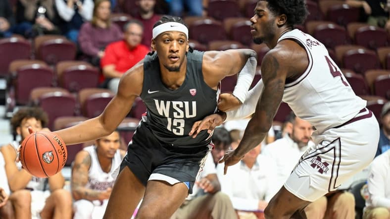 Nov 18, 2023; Uncasville, CT, USA; Washington State Cougars forward Isaac Jones (13) dribbles the ball defended by Washington State Cougars guard Shae Korpela (4) during the first half at Mohegan Sun Arena. Mandatory Credit: Mark Smith-USA TODAY Sports