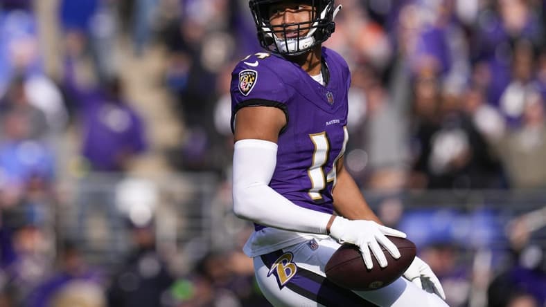 Nov 12, 2023; Baltimore, Maryland, USA;  Baltimore Ravens safety Kyle Hamilton (14) celebrates after scoring a touchdown against the Cleveland Browns during the first quarter at M&T Bank Stadium. Mandatory Credit: Jessica Rapfogel-USA TODAY Sports