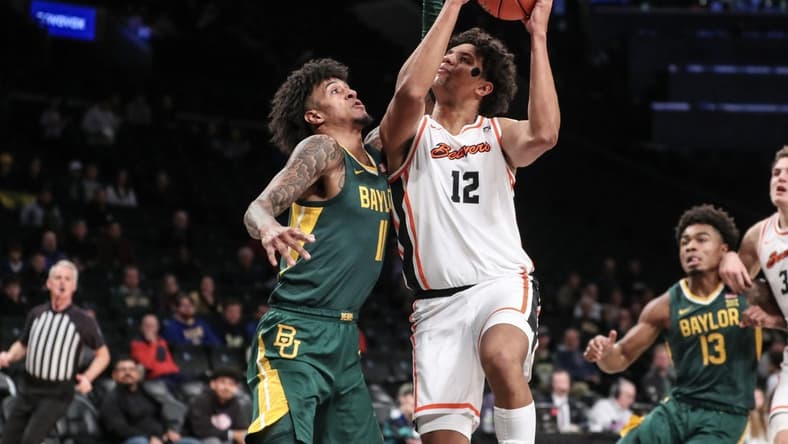 Nov 22, 2023; Brooklyn, NY, USA; Oregon State Beavers forward Michael Rataj (12) looks to drive past Baylor Bears forward Jalen Bridges (11) in the first half at Barclay Center. Mandatory Credit: Wendell Cruz-USA TODAY Sports