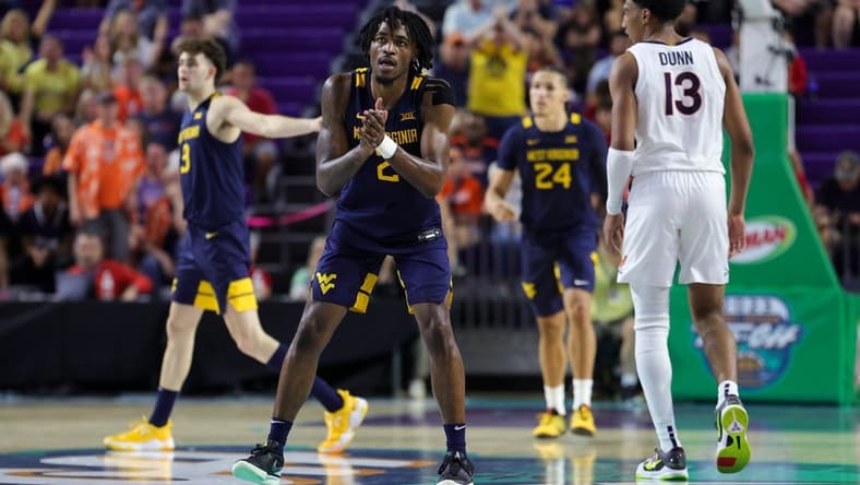 Nov 22, 2023; Fort Myers, FL, USA; West Virginia Mountaineers guard Kobe Johnson (2) reacts after a play against the Virginia Cavaliers in the second half during the Fort Myers Tip-Off third place game at Suncoast Credit Union Arena. Mandatory Credit: Nathan Ray Seebeck-USA TODAY Sports