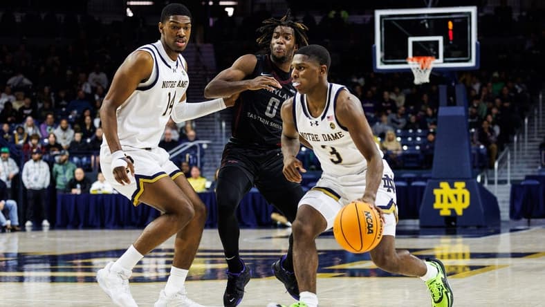 Notre Dame guard Markus Burton (3) drives to the basket as Maryland Eastern Shore guard Toby Nnadozie (0) defends during the Maryland Eastern Shore-Notre Dame NCAA Men   s basketball game on Wednesday, November 22, 2023, at Purcell Pavilion in South Bend, Indiana.