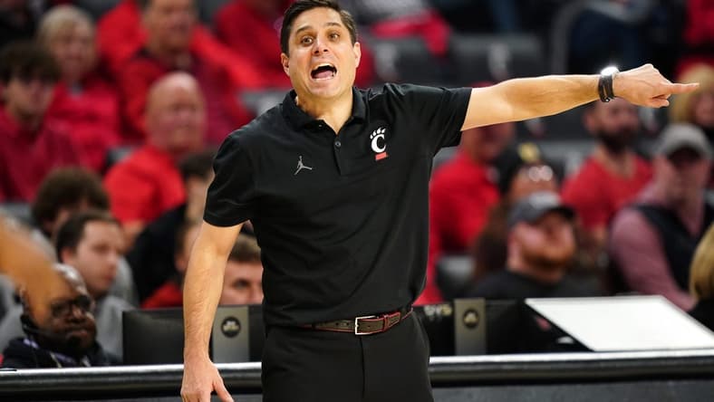 Cincinnati Bearcats head coach Wes Miller instructs the team in the second half during an NCAA college basketball game between Georgia Tech Yellow Jackets and the Cincinnati Bearcats, Wednesday, Nov. 22, 2023, at Fifth Third Arena in Cincinnati.