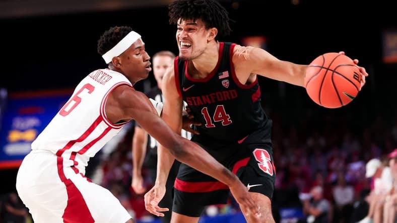Nov 22, 2023; Paradise Island, BAHAMAS; Stanford Cardinal forward Spencer Jones (14) controls the ball as Arkansas Razorbacks guard Layden Blocker (6) defends during the second half at Imperial Arena. Mandatory Credit: Kevin Jairaj-USA TODAY Sports