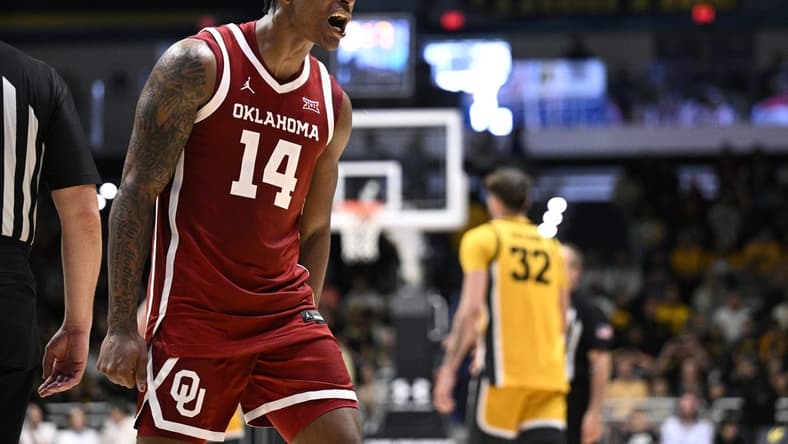 Nov 23, 2023; La Jolla, California, USA; Oklahoma Sooners forward Jalon Moore (14) celebrates after defeating the Iowa Hawkeyes at LionTree Arena. Mandatory Credit: Orlando Ramirez-USA TODAY Sports