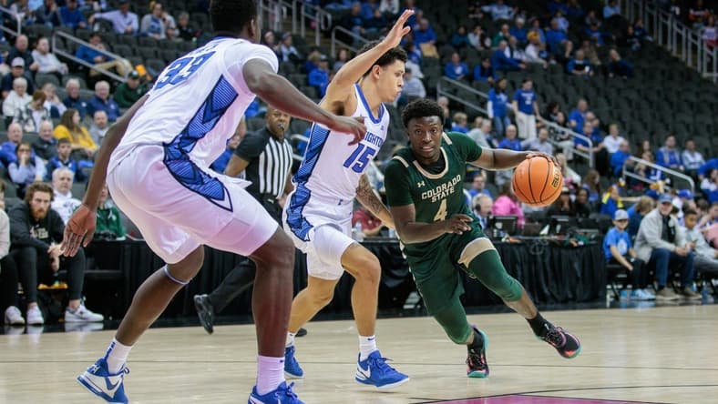 Nov 23, 2023; Kansas City, Missouri, USA; Colorado State Rams guard Isaiah Stevens (4) drives around Creighton Bluejays guard Josiah Dotzler (15) during the second half at T-Mobile Center. Mandatory Credit: William Purnell-USA TODAY Sports