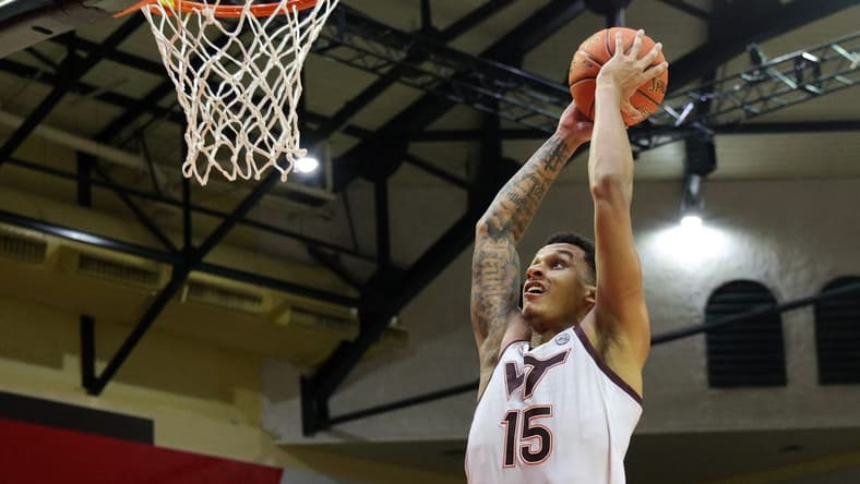 Nov 23, 2023; Kissimmee, FL, USA; Virginia Tech Hokies center Lynn Kidd (15) dunks the ball against the Boise State Broncos in the second half during the ESPN Events Invitational at State Farm Field House. Mandatory Credit: Nathan Ray Seebeck-USA TODAY Sports