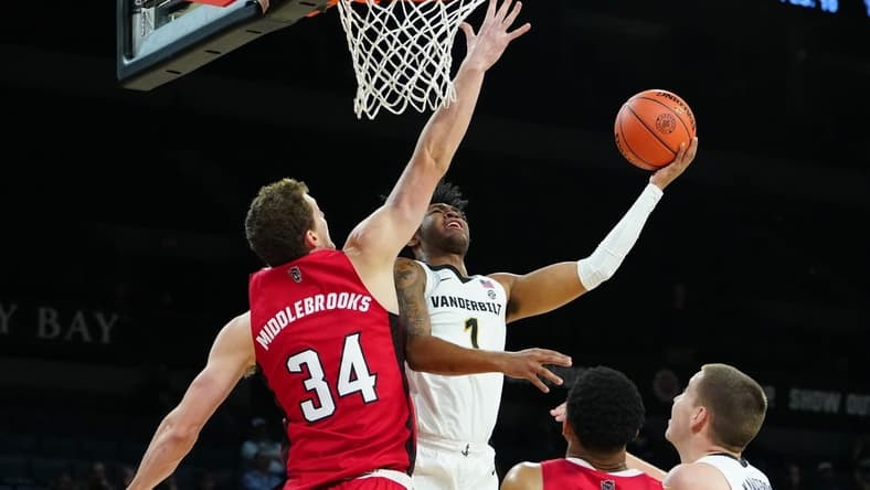 Nov 23, 2023; Las Vegas, Nevada, USA; Vanderbilt Commodores forward Colin Smith (1) shoots against North Carolina State Wolfpack forward Ben Middlebrooks (34) during the first half at Michelob Ultra Arena. Mandatory Credit: Stephen R. Sylvanie-USA TODAY Sports