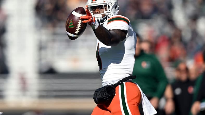 Nov 24, 2023; Chestnut Hill, Massachusetts, USA; Miami Hurricanes wide receiver Colbie Young (4) reacts after making a reception against the Boston College Eagles during the first half at Alumni Stadium. Mandatory Credit: Brian Fluharty-USA TODAY Sports