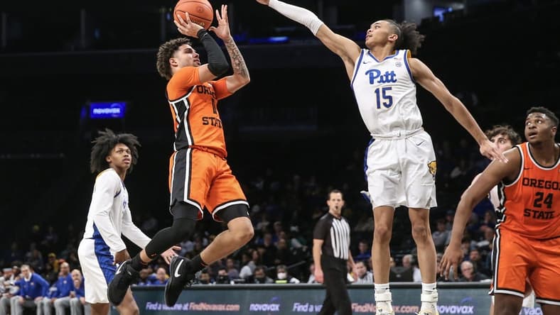 Nov 24, 2023; Brooklyn, NY, USA; Oregon State Beavers guard Dexter Akanno (4) shoots the ball over Pittsburgh Panthers guard Jaland Lowe (15) in the second half at Barclay Center. Mandatory Credit: Wendell Cruz-USA TODAY Sports