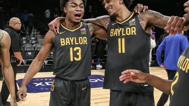 Nov 24, 2023; Brooklyn, NY, USA; Baylor Bears guard Langston Love (13) and forward Jalen Bridges (11) celebrate after beating the Florida Gators to win the NIT Season Tip-Off Championship at Barclay Center. Mandatory Credit: Wendell Cruz-USA TODAY Sports