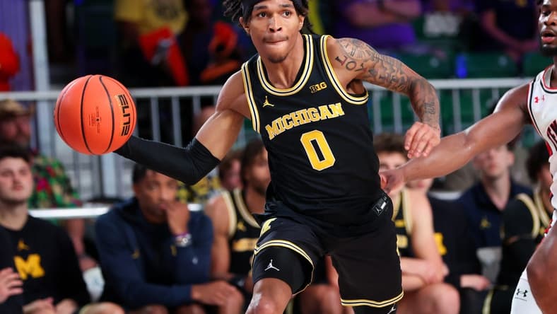 Nov 24, 2023; Paradise Island, BAHAMAS; Michigan Wolverines guard Dug McDaniel (0) passes the ball during the second half against the Texas Tech Red Raiders at Imperial Arena. Mandatory Credit: Kevin Jairaj-USA TODAY Sports