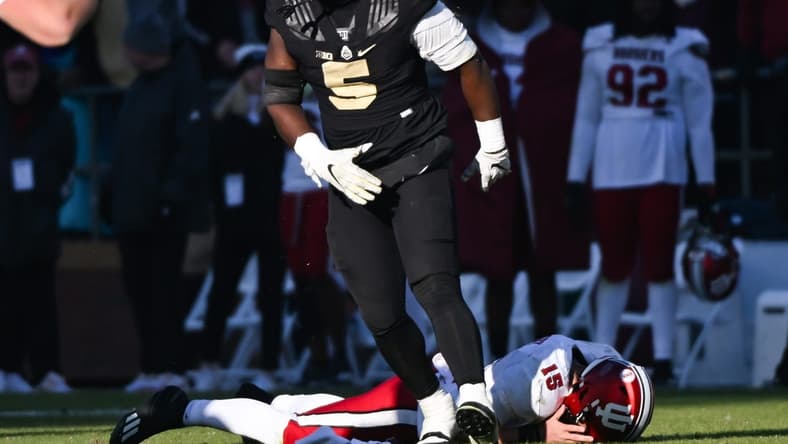 Nov 25, 2023; West Lafayette, Indiana, USA; Purdue Boilermakers linebacker Nic Scourton (5) reacts after bringing down Indiana Hoosiers quarterback Brendan Sorsby (15) during the second half at Ross-Ade Stadium. Mandatory Credit: Robert Goddin-USA TODAY Sports