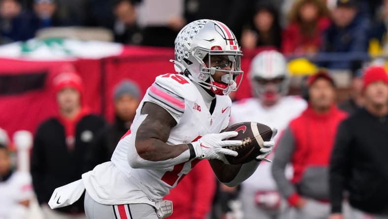 Nov 25, 2023; Ann Arbor, Michigan, USA; Ohio State Buckeyes running back Chip Trayanum (19) carries the ball during the NCAA football game against the Michigan Wolverines at Michigan Stadium. Ohio State lost 30-24.