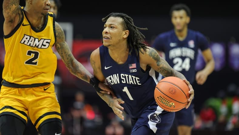 Nov 26, 2023; Kissimmee, FL, USA; Penn State Nittany Lions guard Ace Baldwin Jr. (1) drives to the hoop past Virginia Commonwealth Rams guard Zeb Jackson (2) in the second half during the ESPN Invitational Events tournament seventh place game at State Farm Field House. Mandatory Credit: Nathan Ray Seebeck-USA TODAY Sports