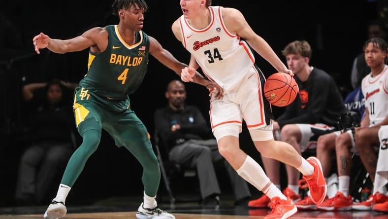 Nov 22, 2023; Brooklyn, NY, USA; Oregon State Beavers forward Tyler Bilodeau (34) and Baylor Bears guard Ja'Kobe Walter (4) at Barclay Center. Mandatory Credit: Wendell Cruz-USA TODAY Sports