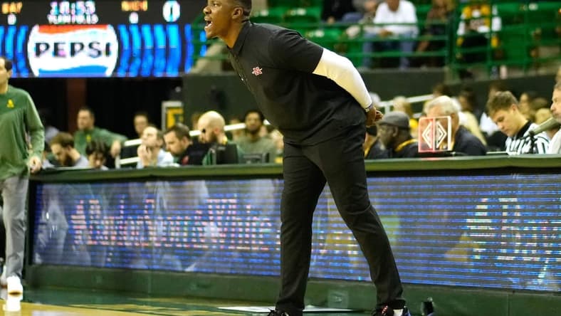 Nov 28, 2023; Waco, Texas, USA;  Nicholls State Colonels head coach Tevon Saddler calls a play against the Baylor Bears during the first half at Ferrell Center. Mandatory Credit: Chris Jones-USA TODAY Sports