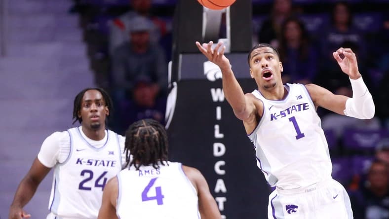 Kansas State senior wing David N'Guessan (1) reaches for a rebound during the first half of Tuesday's game against Oral Roberts inside Bramlage Coliseum.