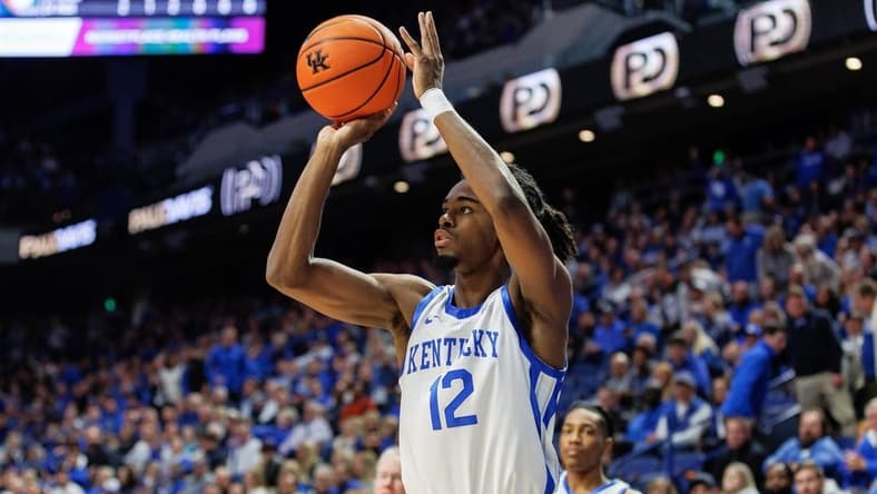Nov 28, 2023; Lexington, Kentucky, USA; Kentucky Wildcats guard Antonio Reeves (12) shoots the ball during the second half against the Miami (Fl) Hurricanes at Rupp Arena at Central Bank Center. Mandatory Credit: Jordan Prather-USA TODAY Sports