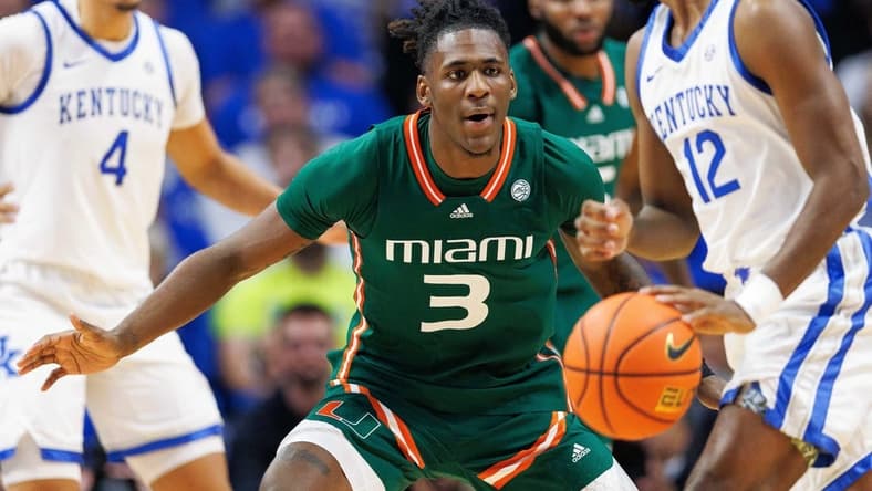 Nov 28, 2023; Lexington, Kentucky, USA; Miami (Fl) Hurricanes guard Christian Watson (3) guards Kentucky Wildcats guard Antonio Reeves (12) during the first half at Rupp Arena at Central Bank Center. Mandatory Credit: Jordan Prather-USA TODAY Sports