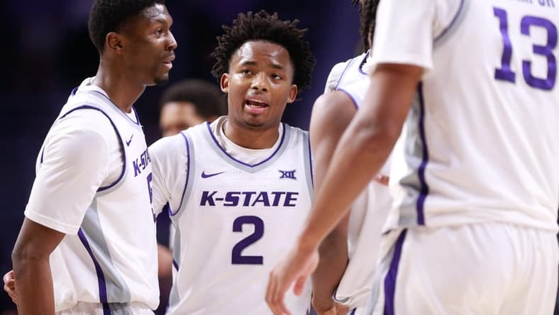 Kansas State graduate transfer guard Tylor Perry (2) brings in his teammates to a huddle during overtime of Tuesday's game against Oral Roberts inside Bramlage Coliseum.